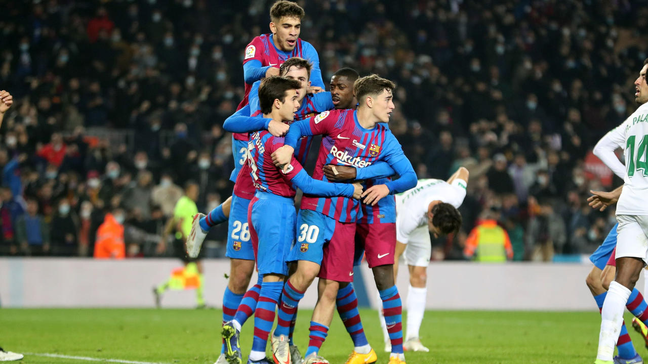 Barcelona players celebrate together after scoring against Elche