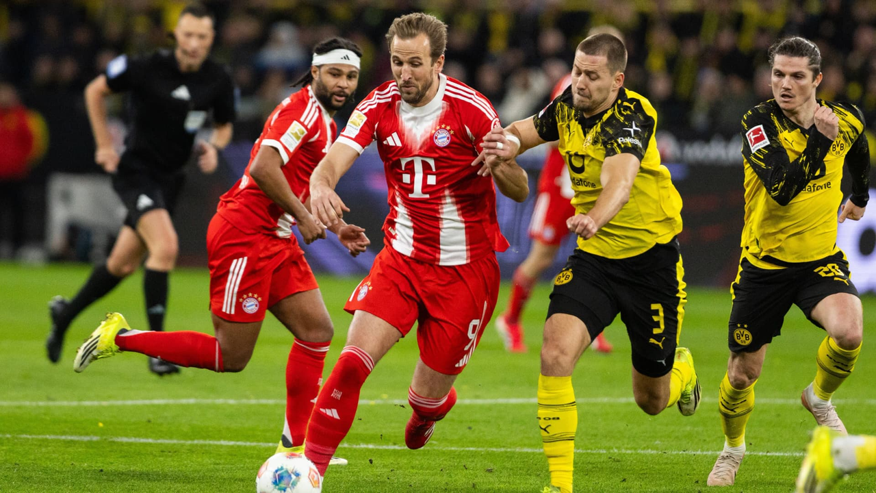 Bayern Munich and Borussia Dortmund players contest the ball