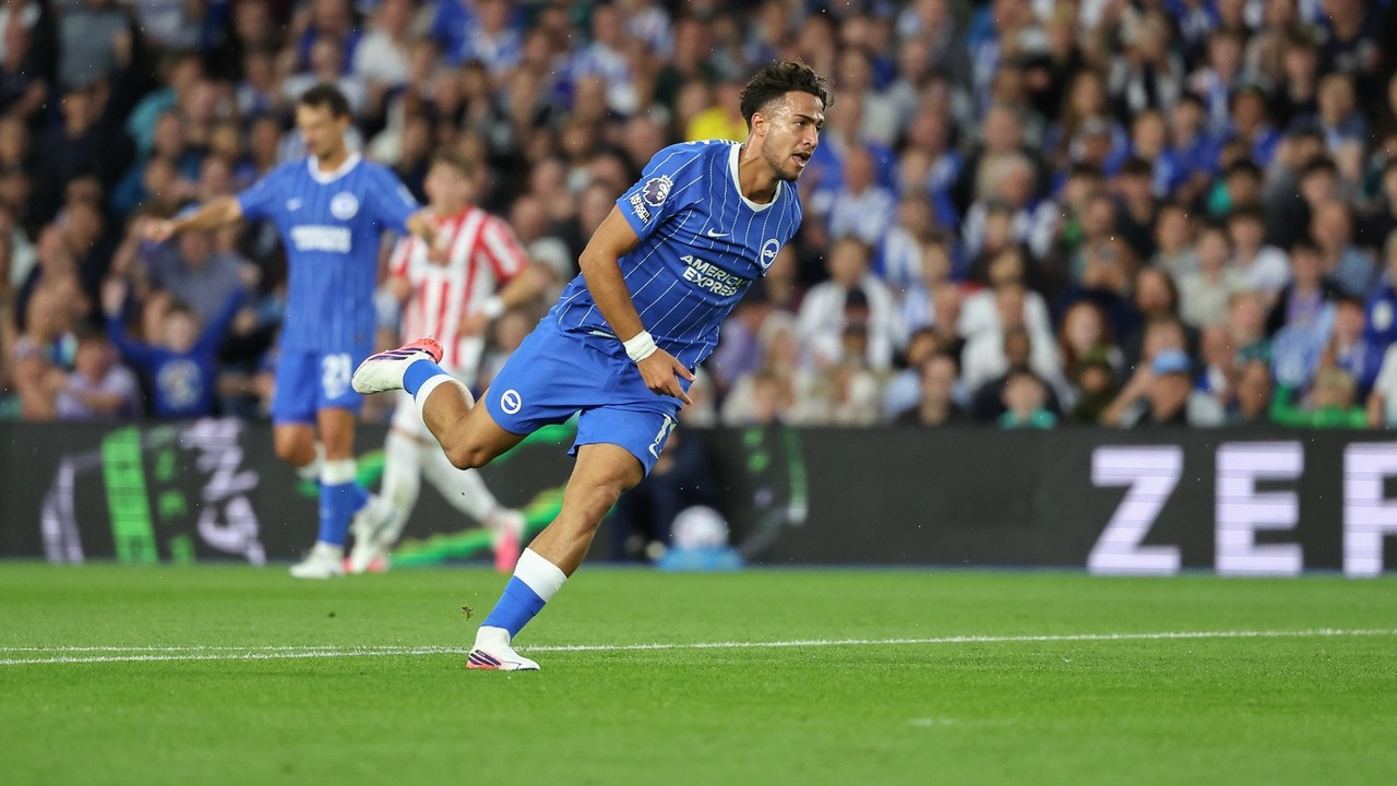 A Brighton player carries the ball against Tromso