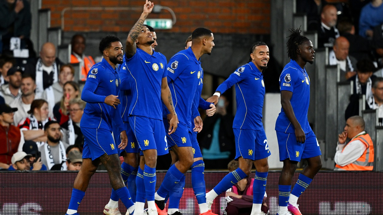 Chelsea players gather after a goal against Fulham
