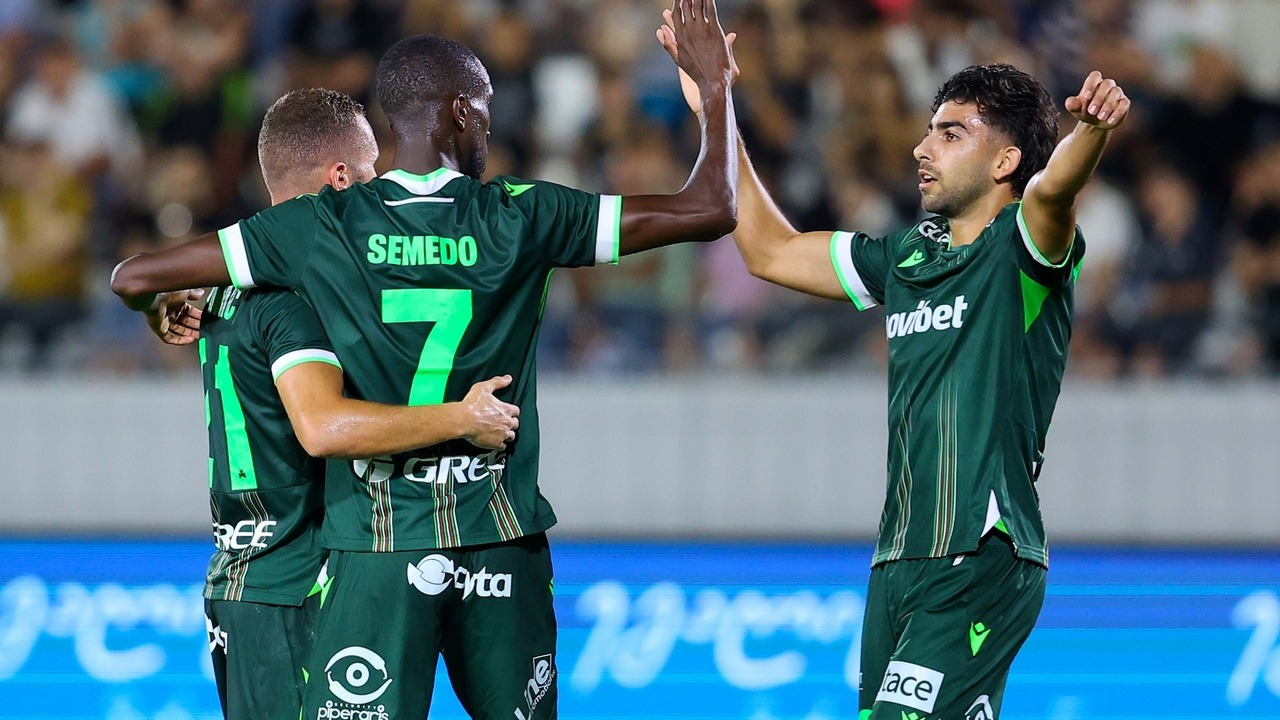 Omonia players celebrate a goal together