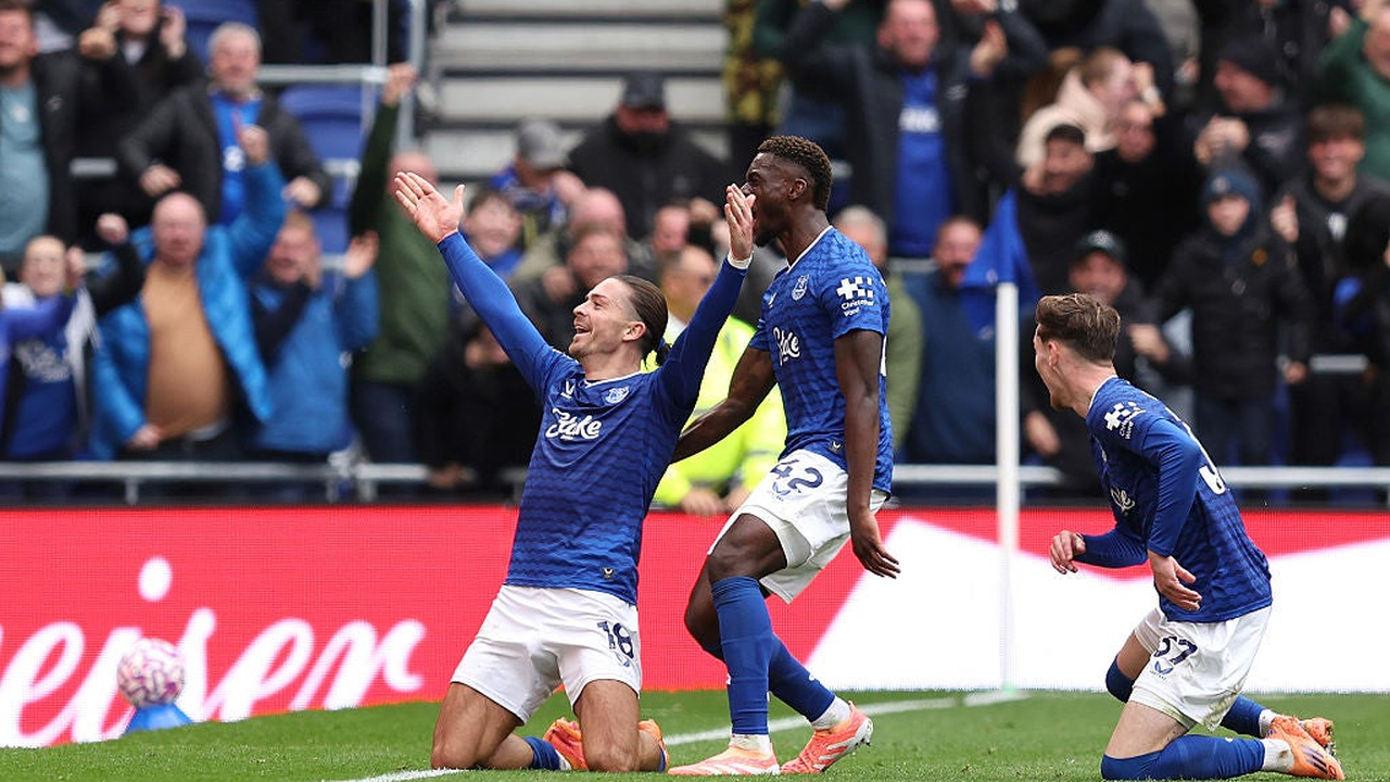Everton players celebrate a goal at their home stadium