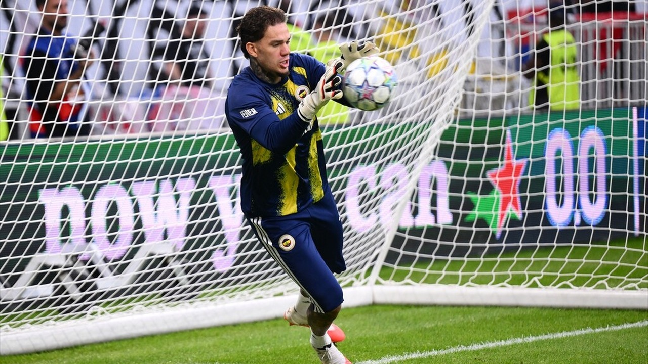 Fenerbahce goalkeeper Ederson catches the ball before the match in Lyon