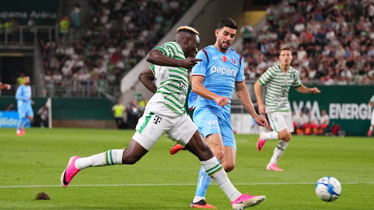 Players challenge for the ball in the Ferencvaros and Trabzonspor match