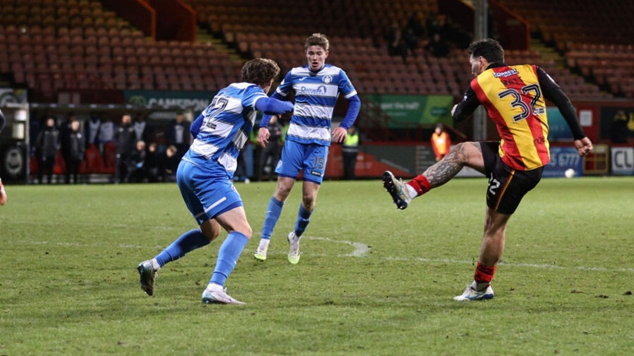 Partick Thistle players move forward during a match