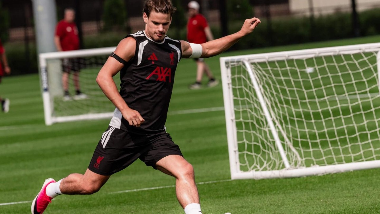 A Liverpool player strikes the ball during training