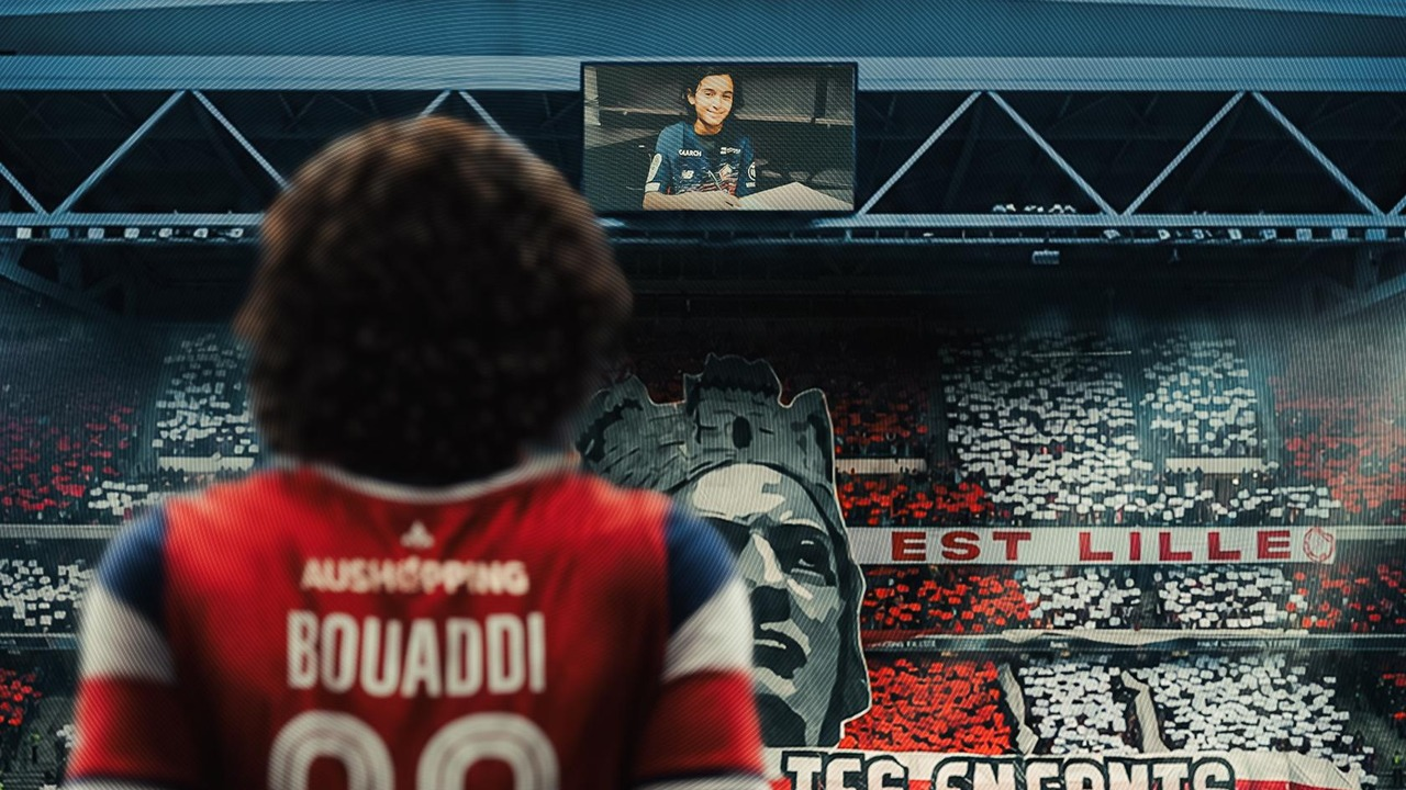 Ayyoub Bouaddi signs the paperwork at Manchester City