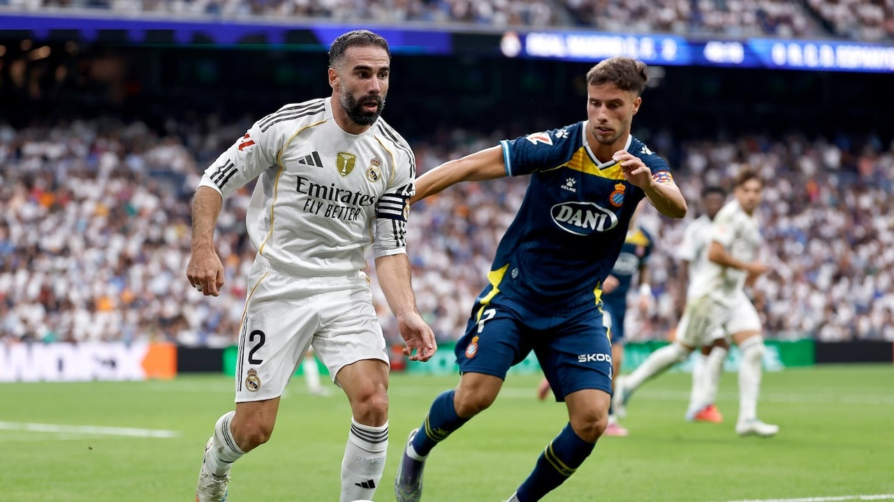 Real Madrid and Espanyol players contest the ball